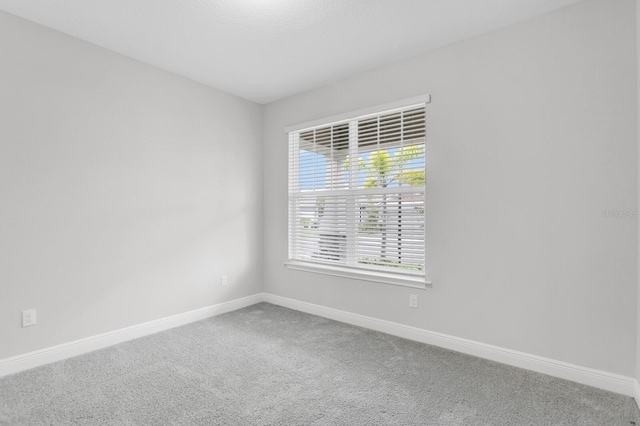 5770 Long Shore Loop, Sarasota, FL 34238 - spare room with baseboards and carpet