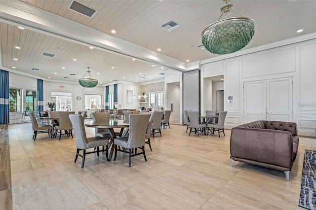 5770 Long Shore Loop, Sarasota, FL 34238 - dining space featuring ornamental molding, a decorative wall, recessed lighting, and wood ceiling
