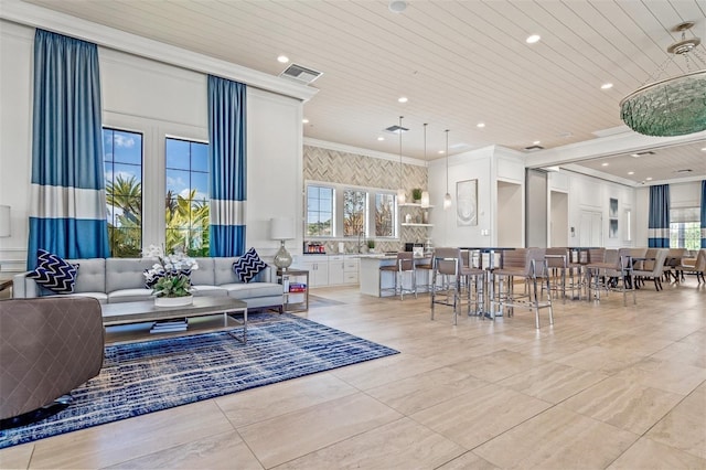 5770 Long Shore Loop, Sarasota, FL 34238 - living area featuring plenty of natural light, ornamental molding, wood ceiling, and recessed lighting