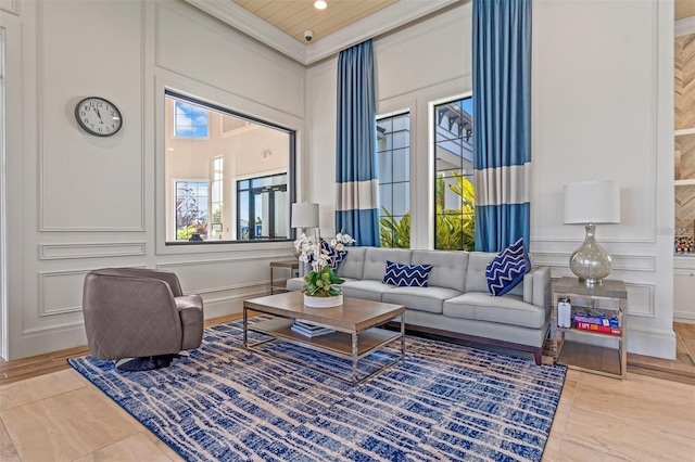 5770 Long Shore Loop, Sarasota, FL 34238 - living room with a decorative wall, crown molding, and recessed lighting