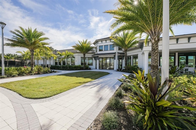 5770 Long Shore Loop, Sarasota, FL 34238 - view of front facade with stucco siding and a front yard
