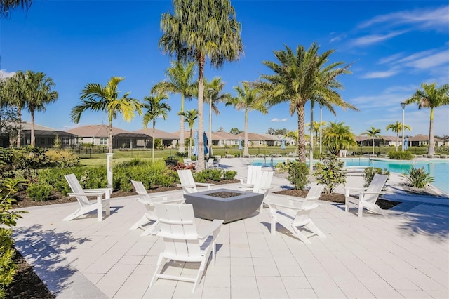 5770 Long Shore Loop, Sarasota, FL 34238 - view of patio featuring an outdoor fire pit, a community pool, and a residential view
