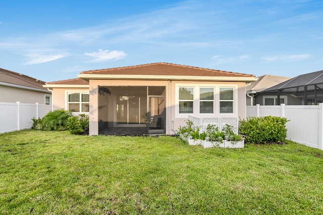 5770 Long Shore Loop, Sarasota, FL 34238 - rear view of house with stucco siding, a sunroom, and a tile roof