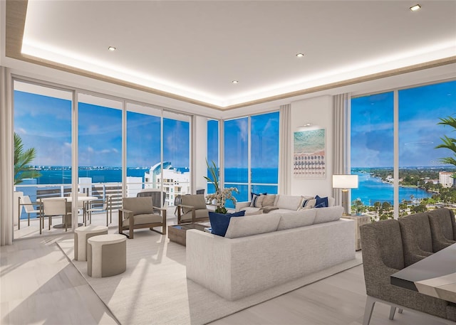 555 Quay Cmn Unit 1005, Sarasota, FL 34236 - living room with a wall of windows, a water view, a raised ceiling, and recessed lighting