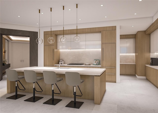 555 Quay Cmn Unit 1003, Sarasota, FL 34236 - kitchen featuring modern cabinets, light countertops, tasteful backsplash, a breakfast bar, and recessed lighting