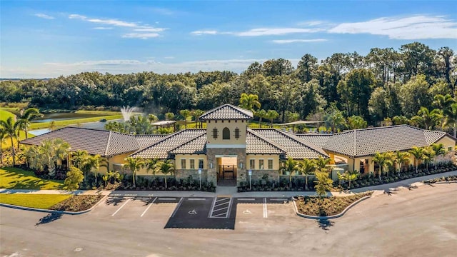 view of property with uncovered parking