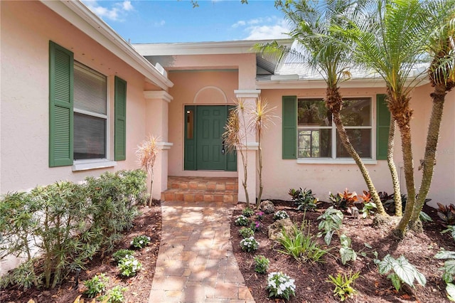 4443 Robin Hood Trl W, Sarasota, FL 34232 - property entrance with stucco siding