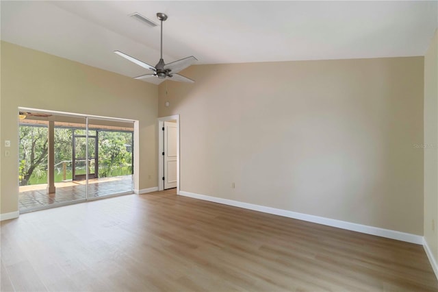 4443 Robin Hood Trl W, Sarasota, FL 34232 - unfurnished room featuring baseboards, wood finished floors, ceiling fan, and high vaulted ceiling