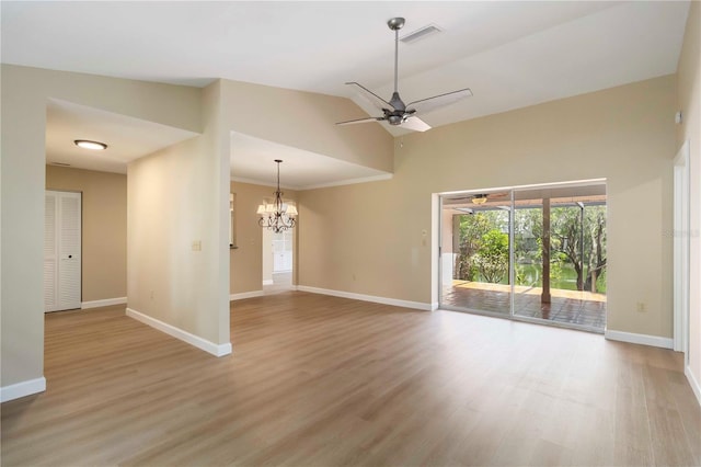 4443 Robin Hood Trl W, Sarasota, FL 34232 - spare room featuring a ceiling fan, a chandelier, baseboards, and high vaulted ceiling