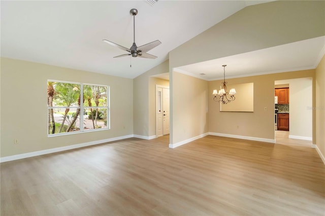 4443 Robin Hood Trl W, Sarasota, FL 34232 - empty room featuring a chandelier, lofted ceiling, light wood-style floors, ceiling fan, and baseboards