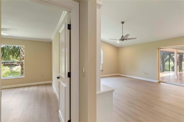 4443 Robin Hood Trl W, Sarasota, FL 34232 - spare room with light wood-style floors, healthy amount of natural light, crown molding, and ceiling fan