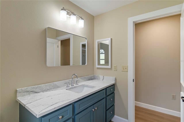 4443 Robin Hood Trl W, Sarasota, FL 34232 - bathroom featuring wood finished floors, vanity, and baseboards