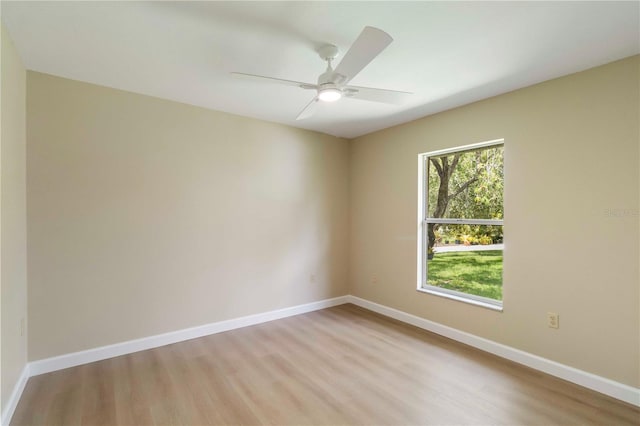 4443 Robin Hood Trl W, Sarasota, FL 34232 - empty room featuring light wood finished floors, ceiling fan, and baseboards