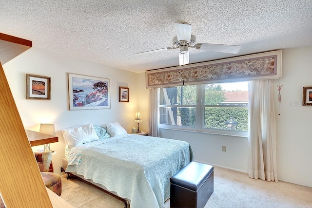 1314 57th St W Unit 1314, Bradenton, FL 34209 - bedroom featuring light carpet, a textured ceiling, and a ceiling fan