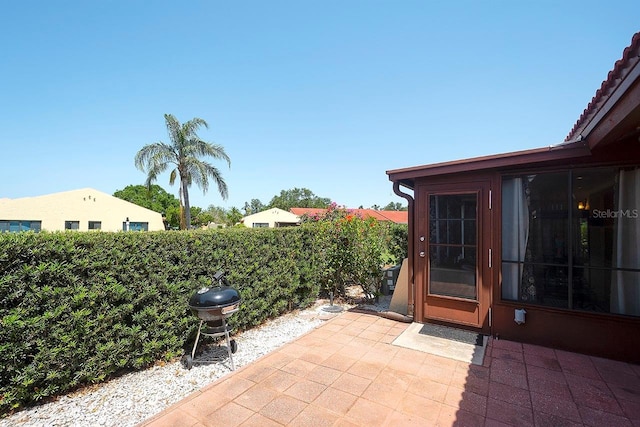 1314 57th St W Unit 1314, Bradenton, FL 34209 - view of patio featuring grilling area and fence