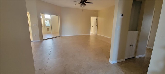 7102 52nd Dr E, Bradenton, FL 34203 - spare room with a ceiling fan, light tile patterned floors, and baseboards