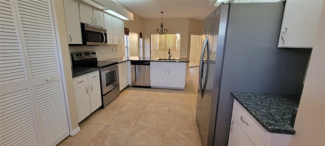 7102 52nd Dr E, Bradenton, FL 34203 - kitchen featuring appliances with stainless steel finishes, a chandelier, hanging light fixtures, light tile patterned floors, and a sink