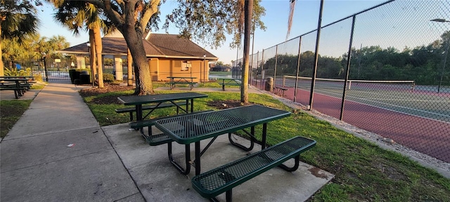 7102 52nd Dr E, Bradenton, FL 34203 - view of property's community featuring a tennis court and fence