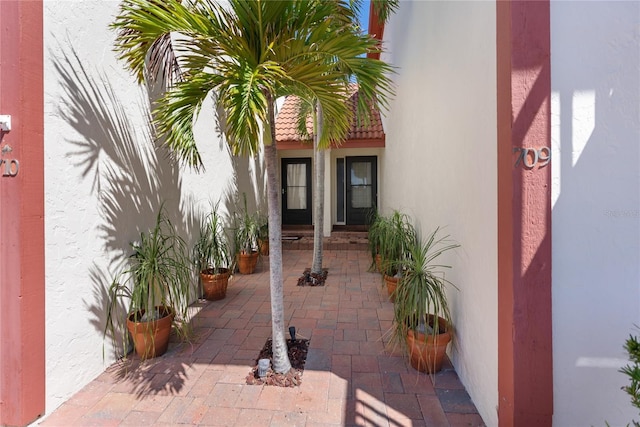 709 Sorrento Inlt Unit 709, Nokomis, FL 34275 - doorway to property featuring stucco siding and a patio