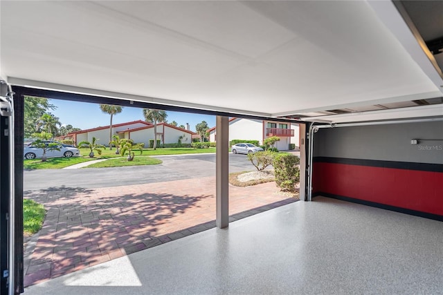 709 Sorrento Inlt Unit 709, Nokomis, FL 34275 - garage featuring baseboards