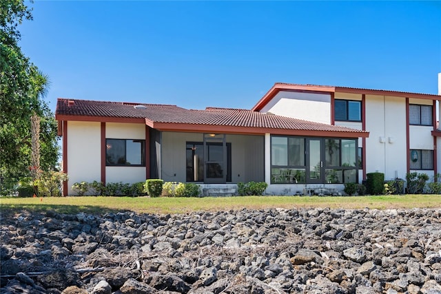 709 Sorrento Inlt Unit 709, Nokomis, FL 34275 - rear view of house with a sunroom