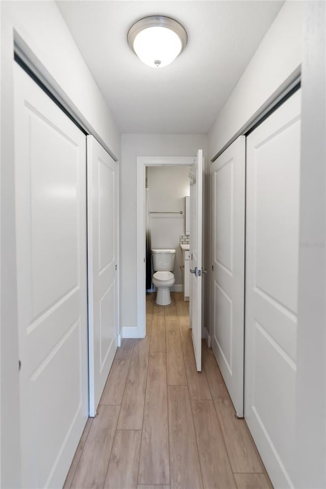 709 Sorrento Inlt Unit 709, Nokomis, FL 34275 - hall with light wood-type flooring and baseboards