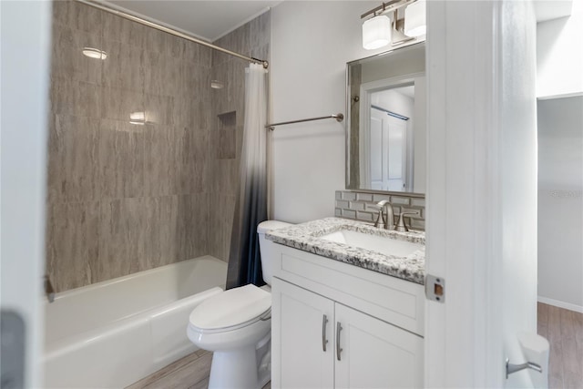 709 Sorrento Inlt Unit 709, Nokomis, FL 34275 - full bathroom featuring shower / bath combination with curtain, vanity, toilet, and wood finished floors