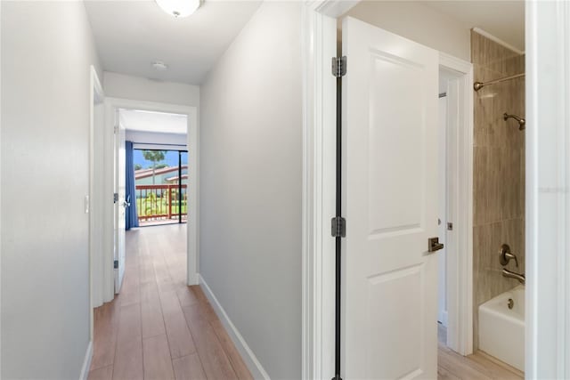 709 Sorrento Inlt Unit 709, Nokomis, FL 34275 - hall featuring baseboards and light wood finished floors