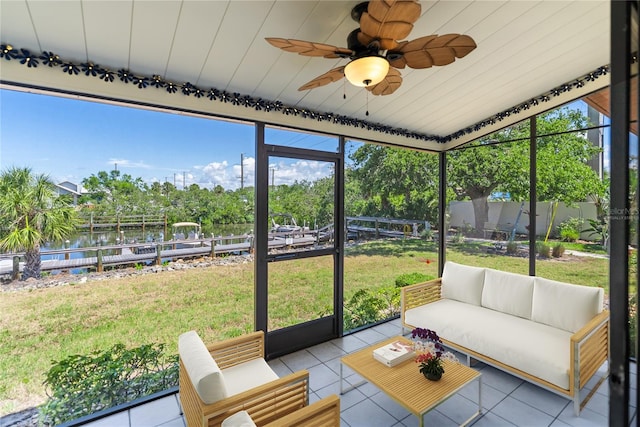 709 Sorrento Inlt Unit 709, Nokomis, FL 34275 - sunroom featuring an outdoor hangout area, a water view, a ceiling fan, and view of wooded area
