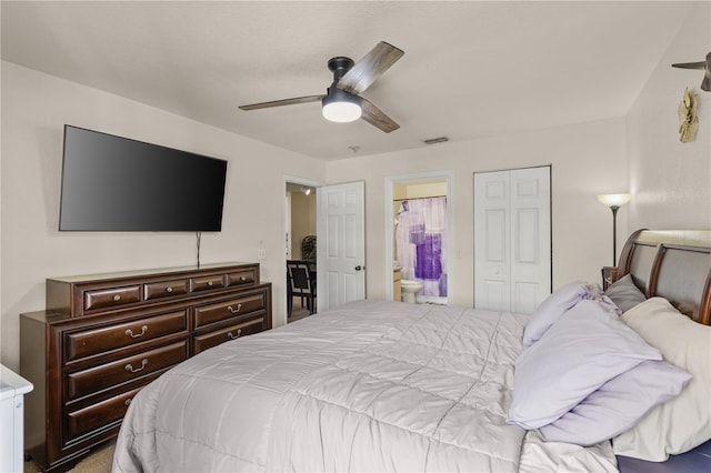 8926 Manor Loop Unit 201, Lakewood Ranch, FL 34202 - bedroom featuring ensuite bath, a ceiling fan, and a closet