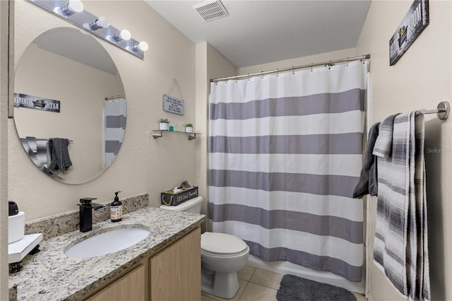8926 Manor Loop Unit 201, Lakewood Ranch, FL 34202 - full bathroom with tile patterned floors, vanity, a shower with shower curtain, and toilet
