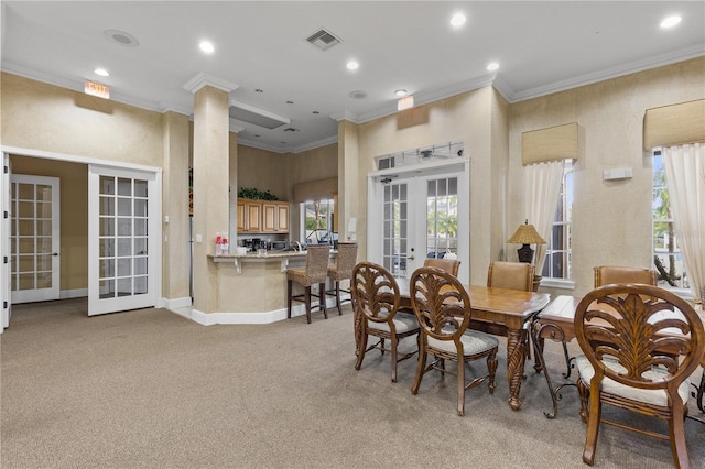8926 Manor Loop Unit 201, Lakewood Ranch, FL 34202 - dining room with french doors, light carpet, recessed lighting, crown molding, and baseboards