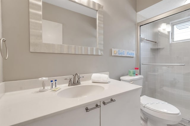603 Cedars Ct, Longboat Key, FL 34228 - bathroom with toilet, a shower stall, and vanity