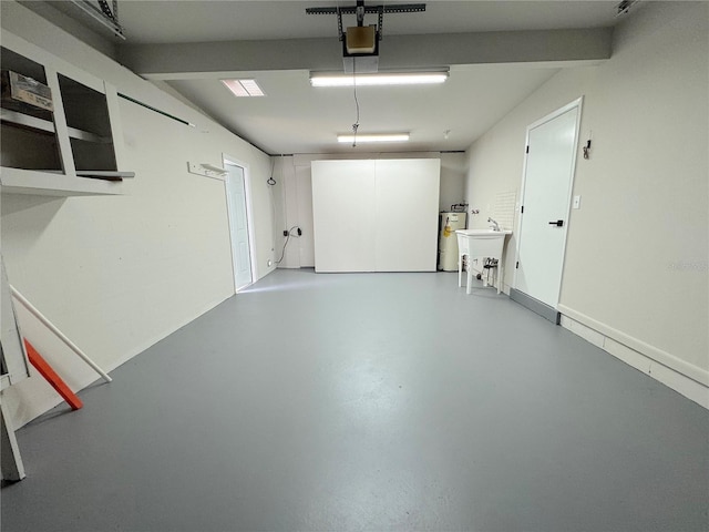 1902 24th Ave W, Bradenton, FL 34205 - garage featuring a garage door opener and water heater