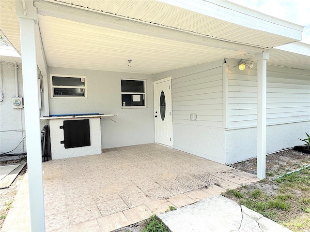 1902 24th Ave W, Bradenton, FL 34205 - view of exterior entry with an attached carport