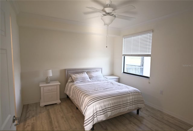 16904 Vardon Ter Unit 208, Lakewood Ranch, FL 34211 - bedroom with ornamental molding, wood finished floors, baseboards, and a ceiling fan