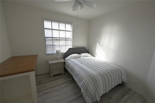 16904 Vardon Ter Unit 208, Lakewood Ranch, FL 34211 - bedroom with light wood-type flooring, baseboards, and ceiling fan