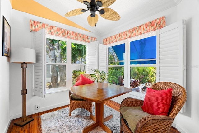 sunroom featuring vaulted ceiling and plenty of natural light