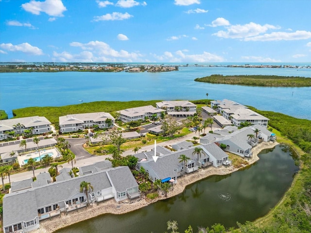 aerial perspective of suburban area with a large body of water