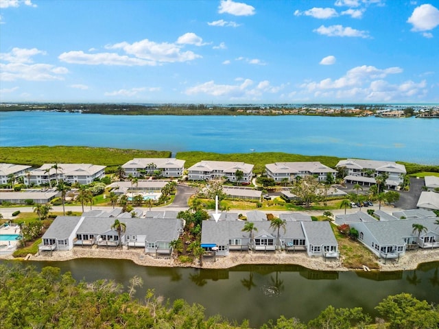 aerial view of residential area with a nearby body of water