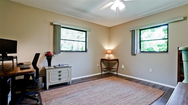 4873 Huntleigh Dr, Sarasota, FL 34233 - office area with plenty of natural light, wood finished floors, a ceiling fan, and baseboards