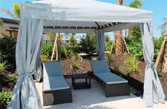 view of patio featuring a gazebo and fence