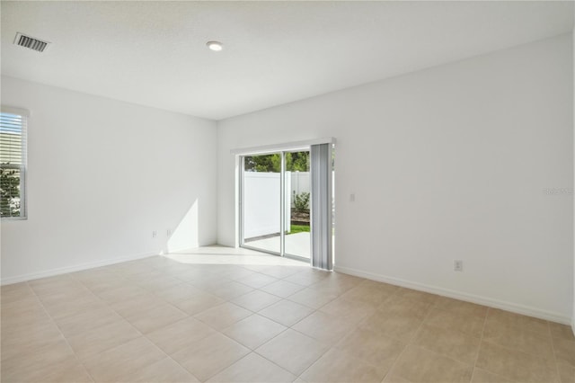 9064 Driven Snow St, Sarasota, FL 34241 - empty room with baseboards and light tile patterned floors