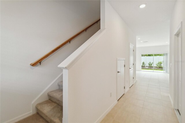 9064 Driven Snow St, Sarasota, FL 34241 - stairway with recessed lighting, tile patterned flooring, and baseboards