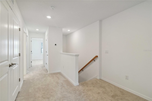 9064 Driven Snow St, Sarasota, FL 34241 - corridor with an upstairs landing, light carpet, recessed lighting, and baseboards