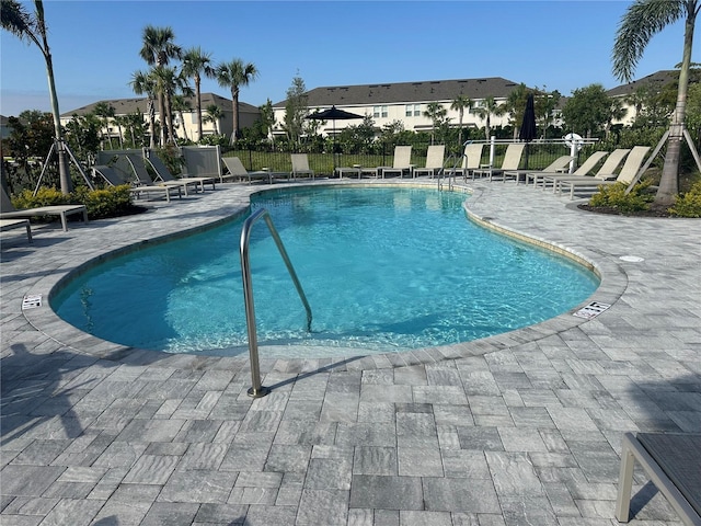 9064 Driven Snow St, Sarasota, FL 34241 - community pool featuring a patio area and a residential view