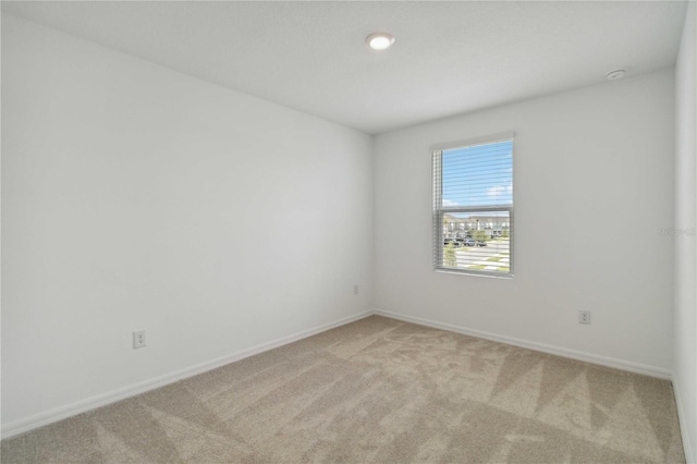 9064 Driven Snow St, Sarasota, FL 34241 - unfurnished room featuring light carpet and baseboards