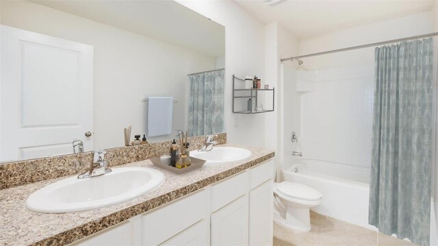 3214 Bitterroot Ln, Lakewood Ranch, FL 34211 - bathroom with shower / bath combo with shower curtain, toilet, double vanity, and tile patterned floors