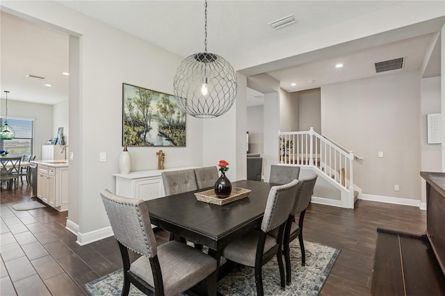 13708 Old Creek Ct, Parrish, FL 34219 - dining room with stairs, dark wood-style flooring, baseboards, recessed lighting, and a chandelier