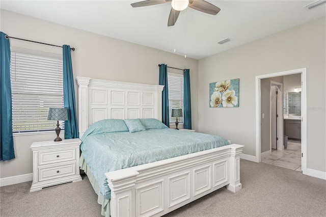 13708 Old Creek Ct, Parrish, FL 34219 - bedroom featuring light carpet, baseboards, a ceiling fan, and ensuite bath